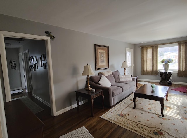 living room with dark wood-style floors and baseboards