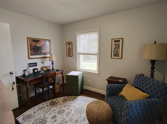 office area featuring baseboards and dark wood finished floors