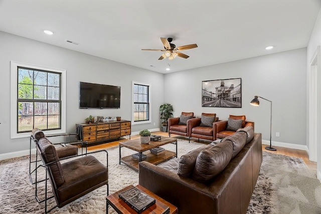 living area with recessed lighting, visible vents, and ceiling fan