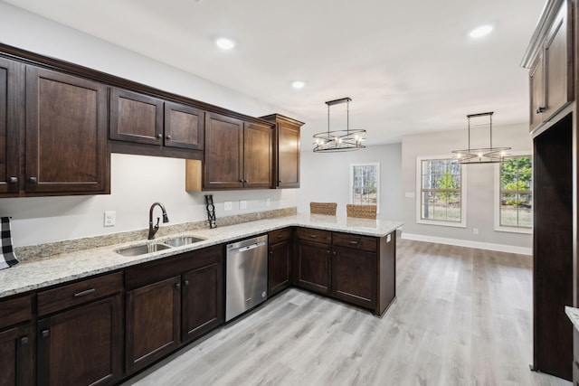 kitchen with dark brown cabinetry, dishwasher, light wood-style flooring, a peninsula, and a sink