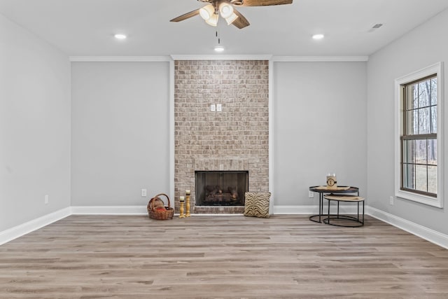 unfurnished living room with baseboards and wood finished floors