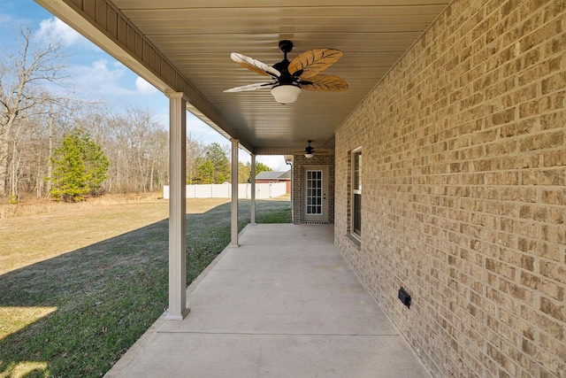 view of patio / terrace with ceiling fan and fence