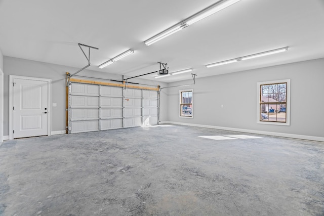 garage featuring baseboards and a garage door opener