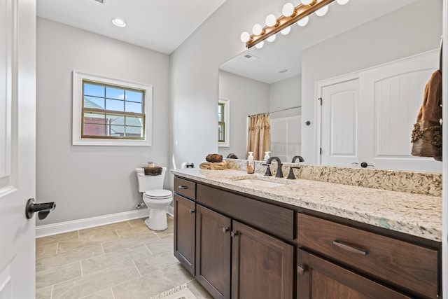 bathroom with baseboards, vanity, toilet, and a shower with curtain