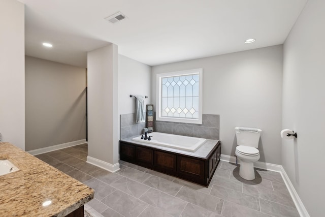 bathroom featuring tile patterned floors, visible vents, toilet, and a bath