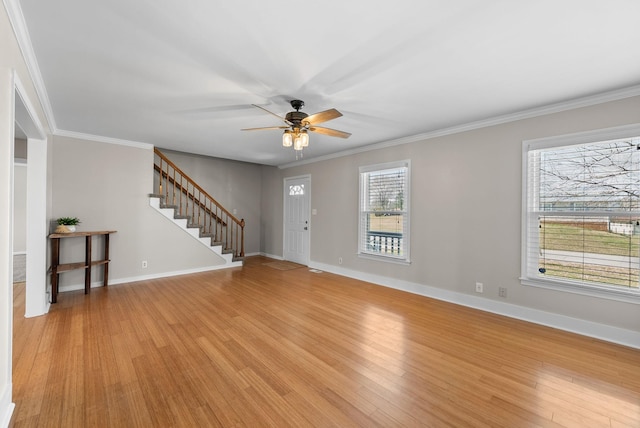 unfurnished living room featuring light wood-type flooring, baseboards, stairs, and ornamental molding