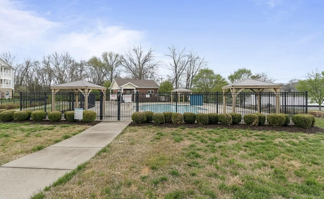 surrounding community featuring a gazebo, a yard, fence, and a pool