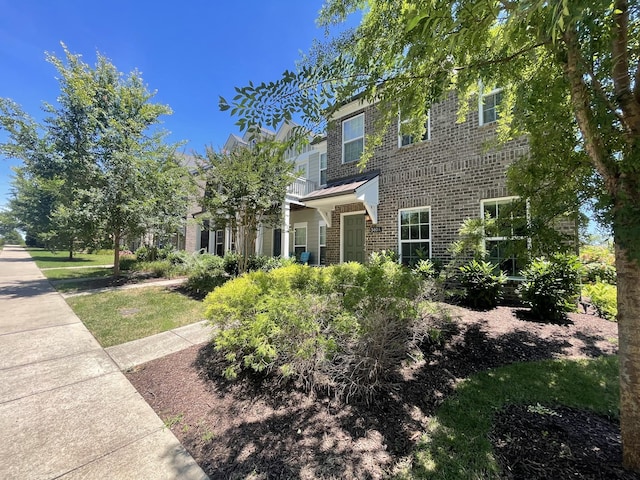 view of front of home with brick siding