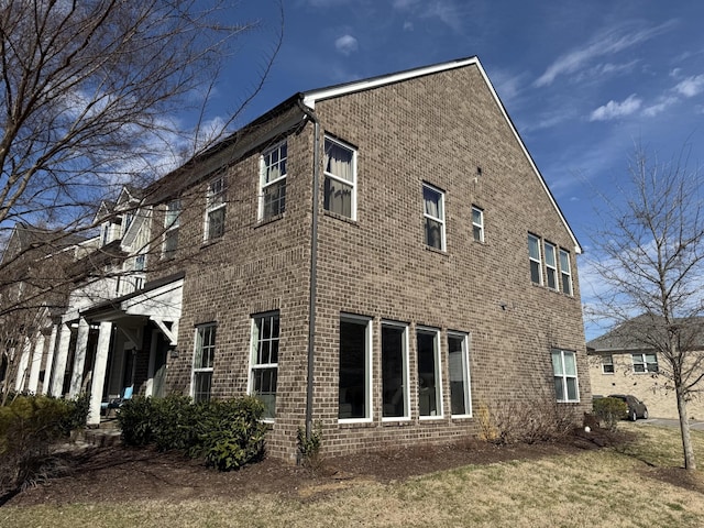 view of home's exterior featuring brick siding