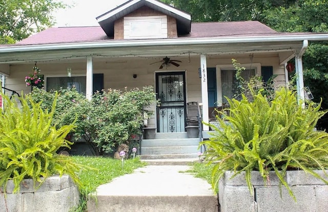 view of exterior entry with covered porch