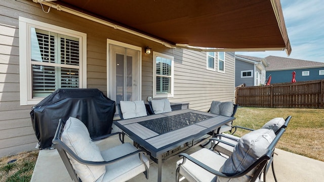 view of patio with an outdoor living space with a fire pit, fence, and a grill