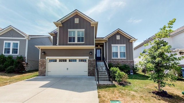 craftsman house with concrete driveway, an attached garage, a front lawn, board and batten siding, and brick siding