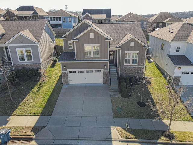 craftsman house featuring a garage, concrete driveway, stone siding, a residential view, and board and batten siding