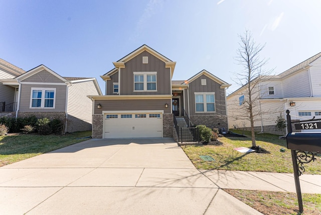 craftsman house with driveway, a garage, a front lawn, and board and batten siding