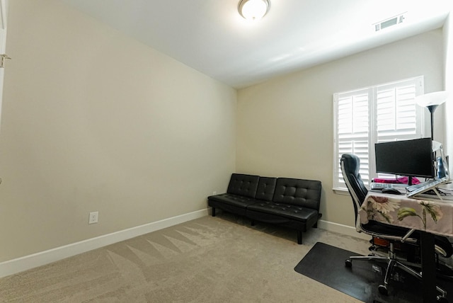 carpeted office with visible vents and baseboards