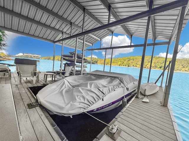 view of dock featuring a water view and boat lift