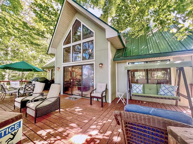 wooden deck featuring outdoor dining area and area for grilling