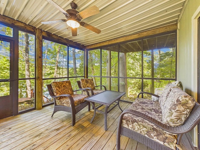 sunroom featuring a ceiling fan