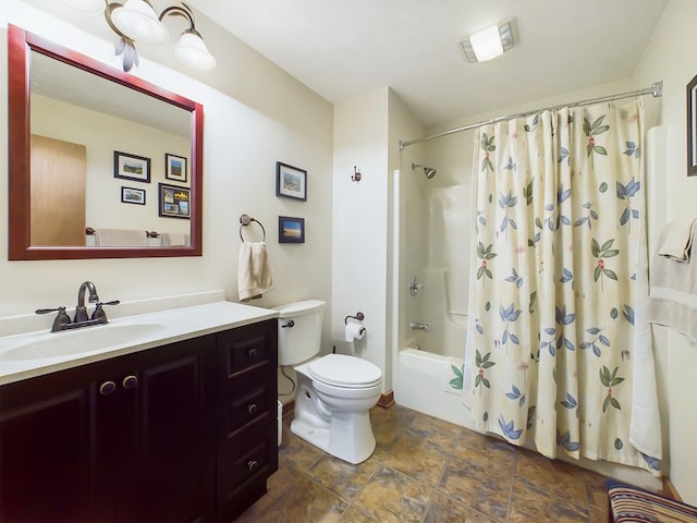 bathroom with shower / tub combo, vanity, and toilet