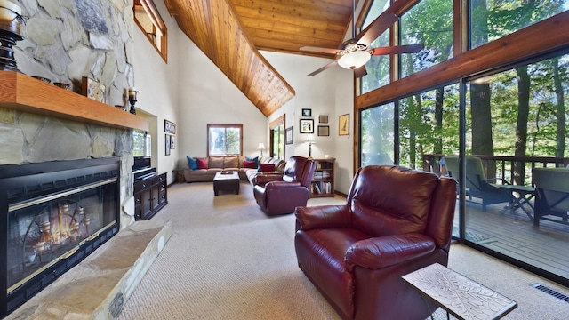 carpeted living room with wood ceiling, a fireplace, visible vents, and ceiling fan