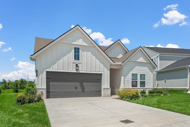 view of front facade with board and batten siding, concrete driveway, roof with shingles, and a garage