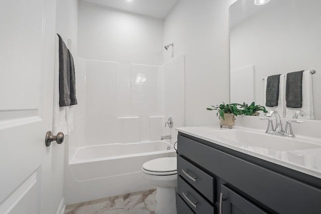 full bathroom with marble finish floor, tub / shower combination, vanity, and toilet