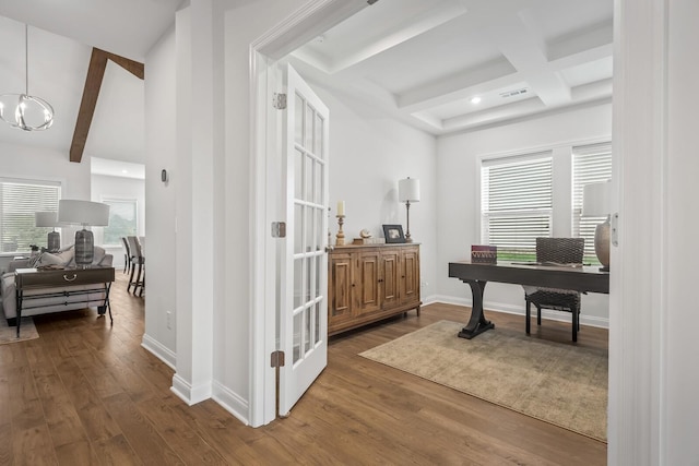 office with beam ceiling, a notable chandelier, visible vents, wood finished floors, and baseboards