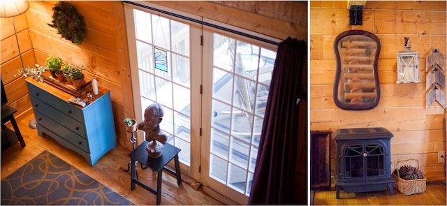 entryway featuring a wood stove, wood walls, and hardwood / wood-style floors