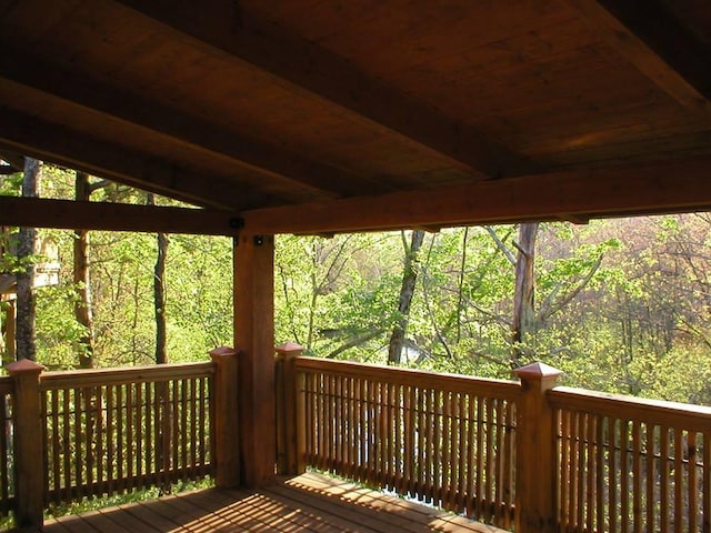 deck featuring a forest view