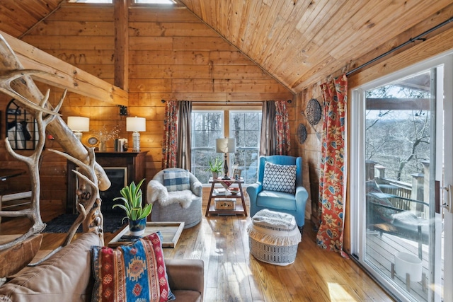 living room with wooden ceiling, vaulted ceiling, and wood-type flooring