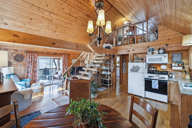 dining space with wood walls, wooden ceiling, and wood-type flooring