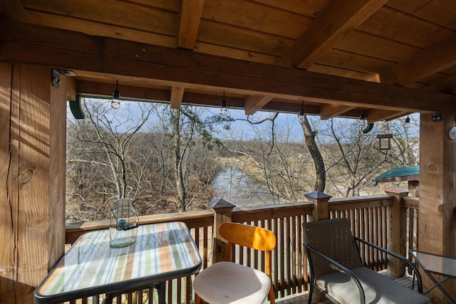 wooden terrace featuring outdoor dining area