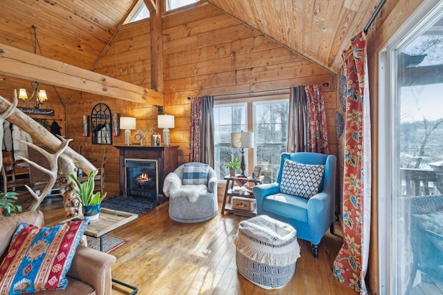 sitting room featuring lofted ceiling, wooden ceiling, and hardwood / wood-style flooring