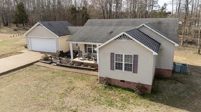 view of front facade featuring a patio, central air condition unit, a shingled roof, crawl space, and a front lawn