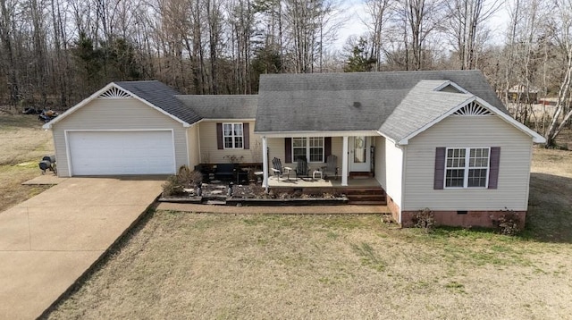 view of front of home with a shingled roof, crawl space, a garage, driveway, and a front lawn