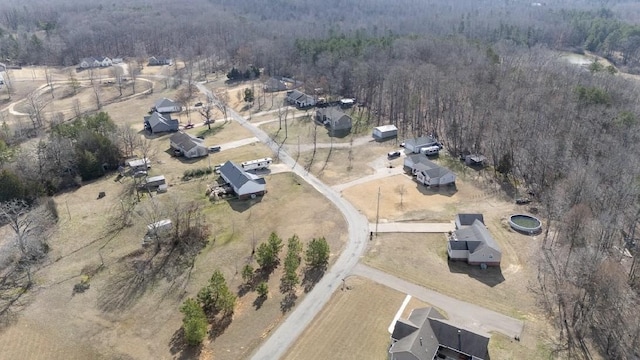 birds eye view of property with a wooded view