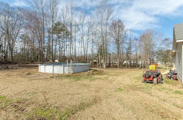 view of yard featuring an outdoor pool