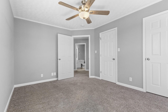 unfurnished bedroom with baseboards, carpet, and crown molding