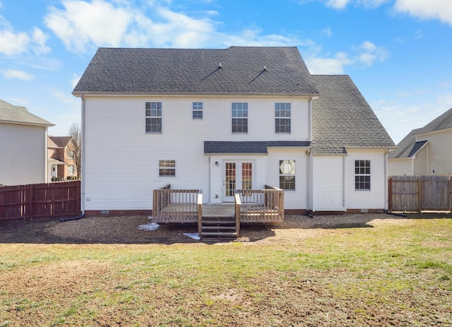 back of house featuring roof with shingles, a lawn, crawl space, fence, and a wooden deck