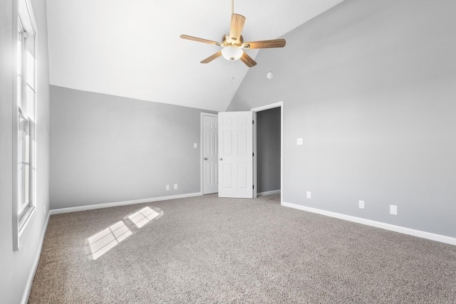 unfurnished bedroom with high vaulted ceiling, carpet, baseboards, and a ceiling fan