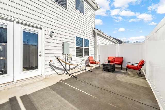 view of patio / terrace with fence and an outdoor living space