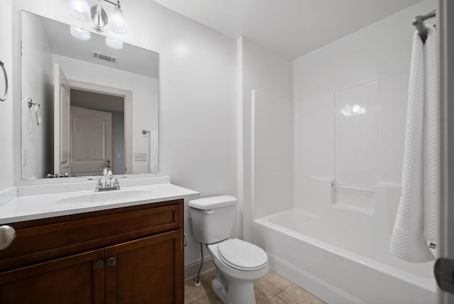 full bathroom with visible vents, toilet, vanity, shower / tub combination, and tile patterned floors