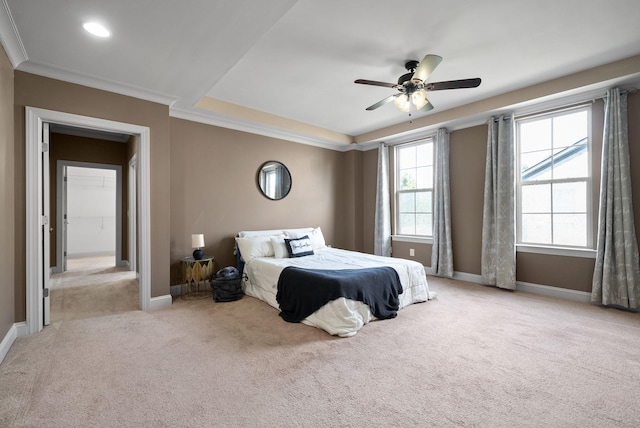 bedroom featuring crown molding, carpet, a ceiling fan, and baseboards