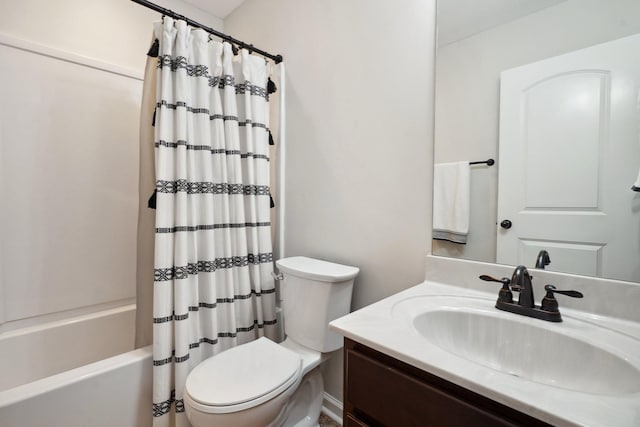 bathroom with shower / bath combo, vanity, and toilet