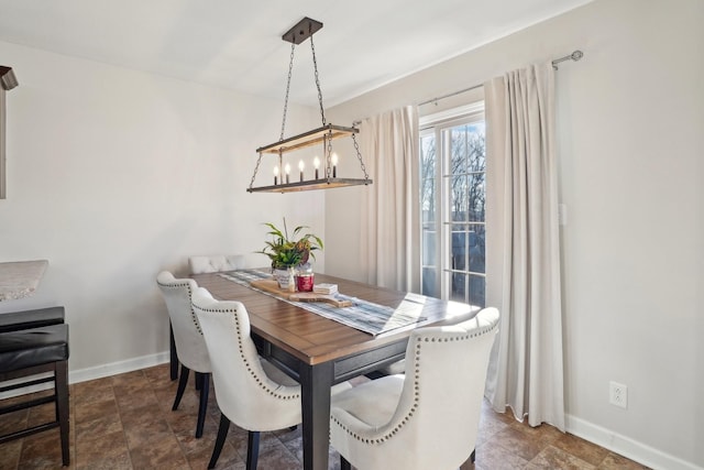 dining space with baseboards