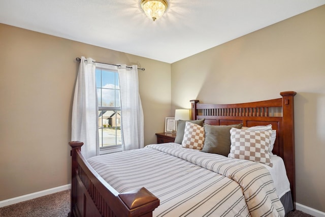 carpeted bedroom with baseboards