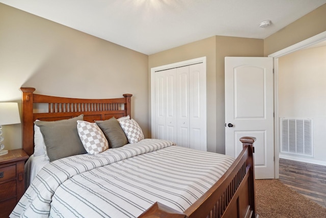 bedroom featuring a closet and visible vents