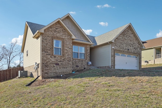 view of front of property featuring an attached garage, central air condition unit, fence, crawl space, and a front yard