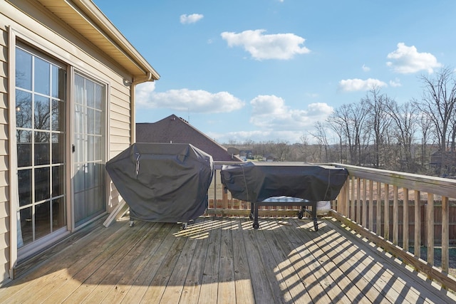 wooden deck featuring grilling area