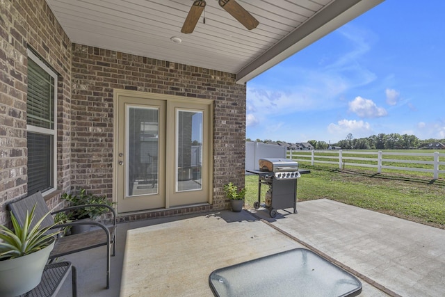 view of patio / terrace with fence, grilling area, and a ceiling fan